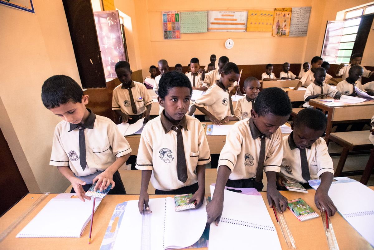 Students at their desks in a Muslim Hands school